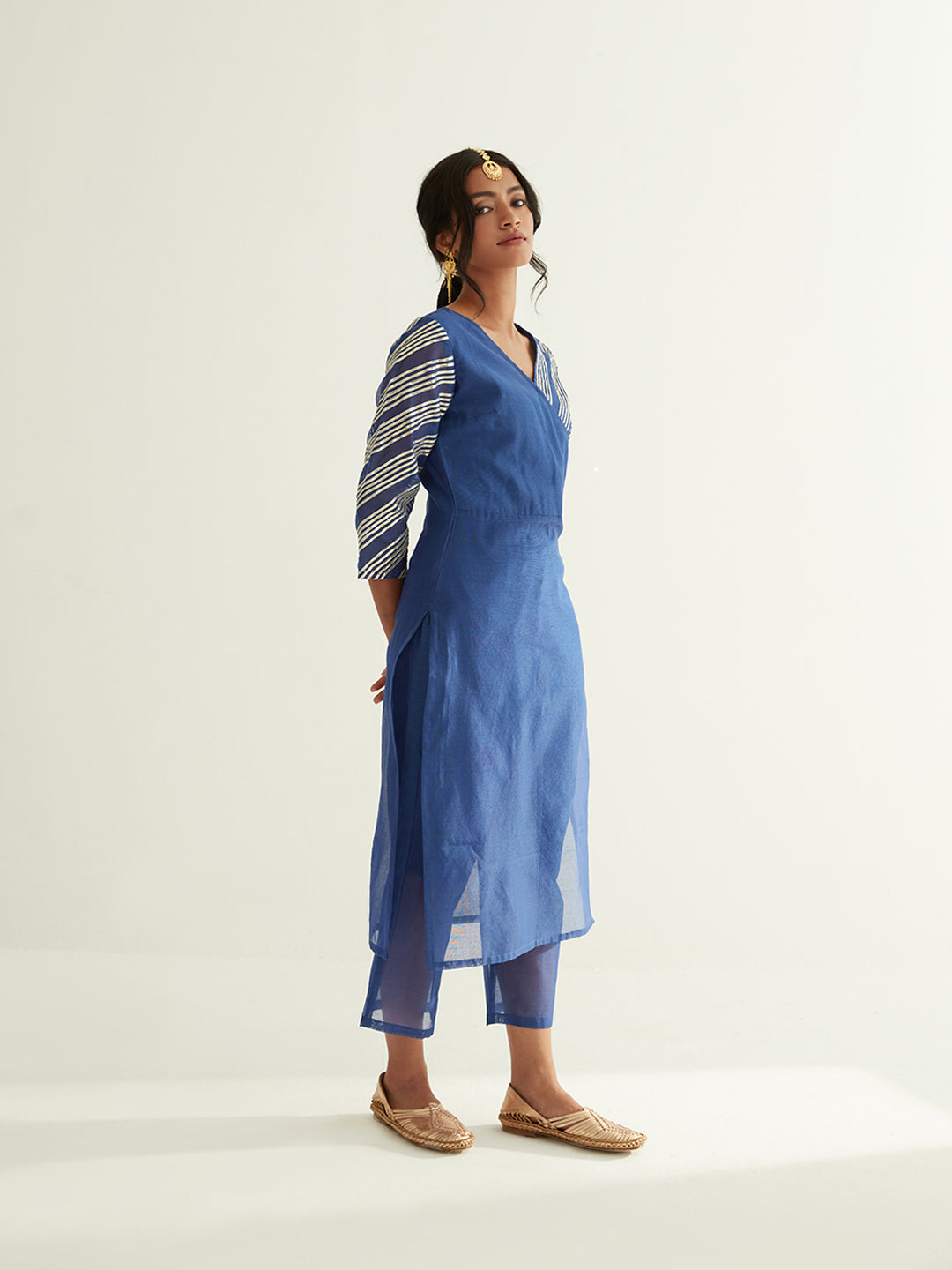 Overlapped neckline chanderi kurta highlighted with Gota Patti with semi-sheer straight pants