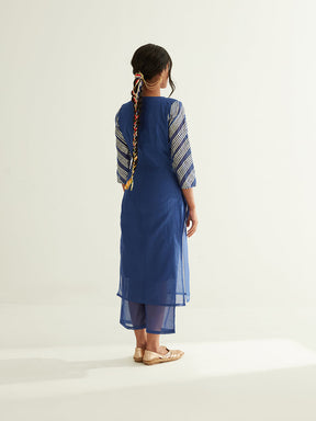 Overlapped neckline chanderi kurta highlighted with Gota Patti with semi-sheer straight pants