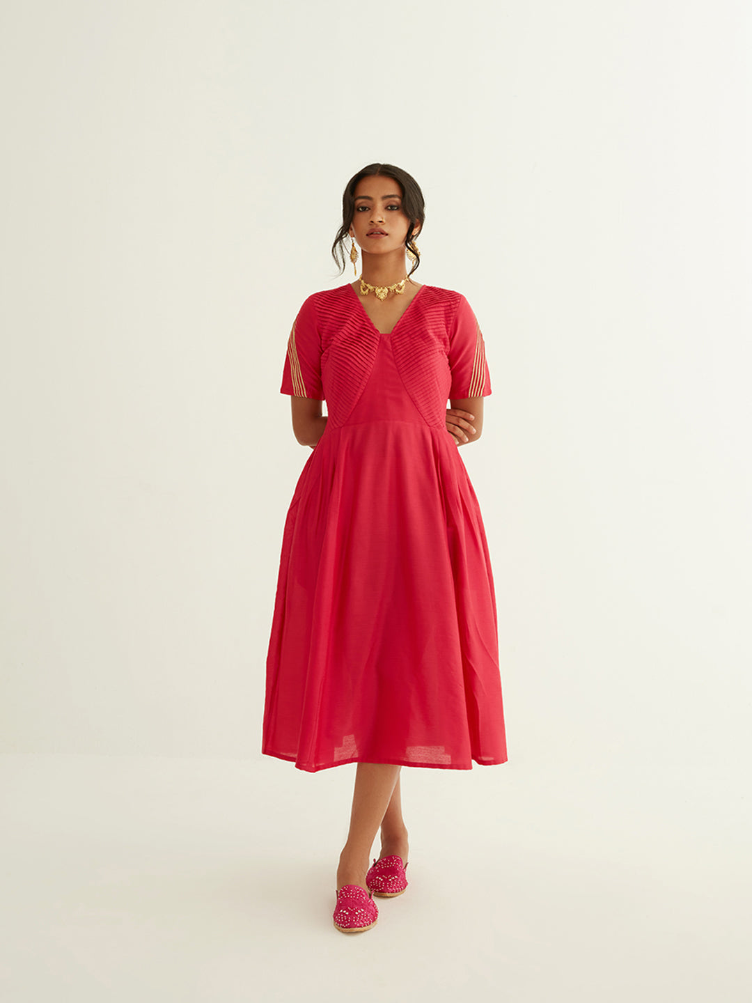 Pleated front dress with lace highlights on sleeves