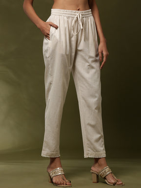 Straight pants with lace detail on hem-beige